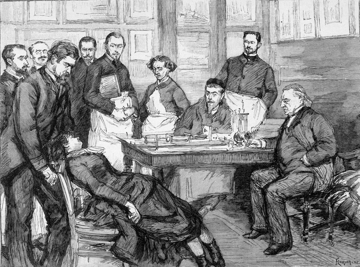 Nineteenth-century engraving of a clinical demonstration: a patient reclining on a chair, surrounded by physicians and students around a table.